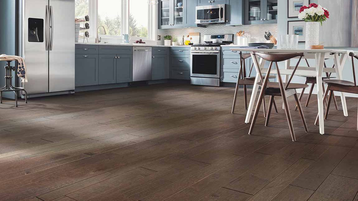 Hardwood flooring a kitchen.